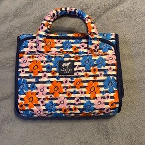 Dabbed Lee travel purse